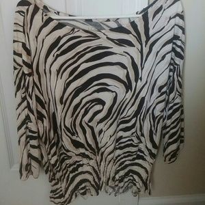 Animal print blouse with gathered bottom.