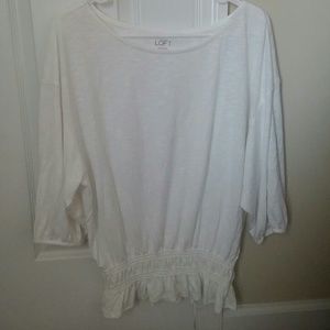 White t-shirt with gathered bottom.