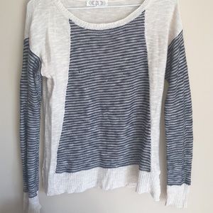 Cute sweater with navy blue stripes.