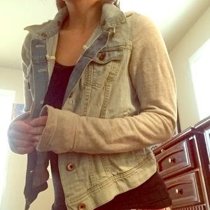 Jean jacket with gray knit sleeves