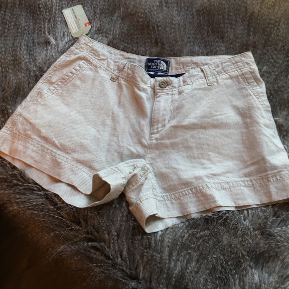 Tan, linen pin-striped shorts.
