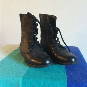 Leather, string up boots.