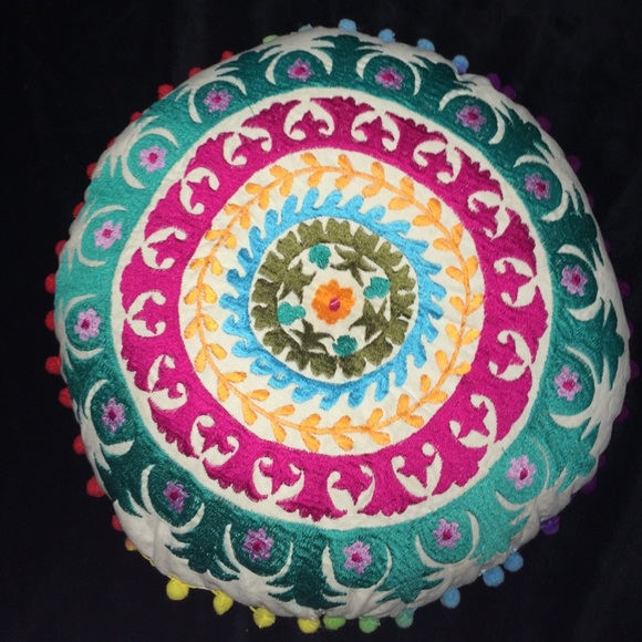 A mandala style circle decorative pillow