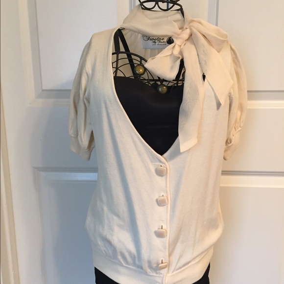 Dressy cardigan with chiffon bow around the neck.