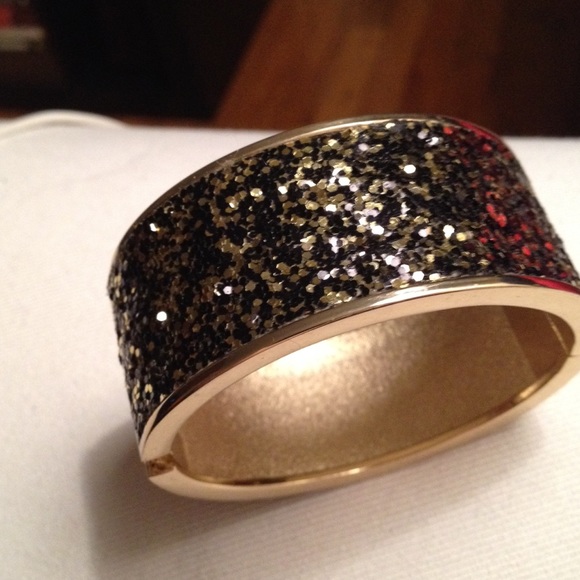 Brand new Sparkling gold and cuff or a bangle.
