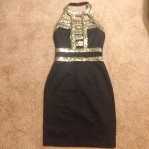 Black and gold sequin dress.