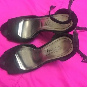 black suede pumps.