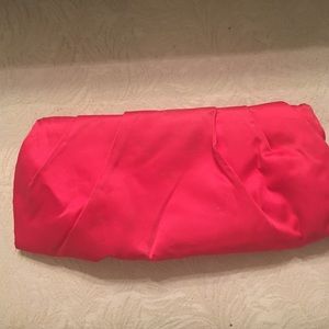 A bright pink clutch