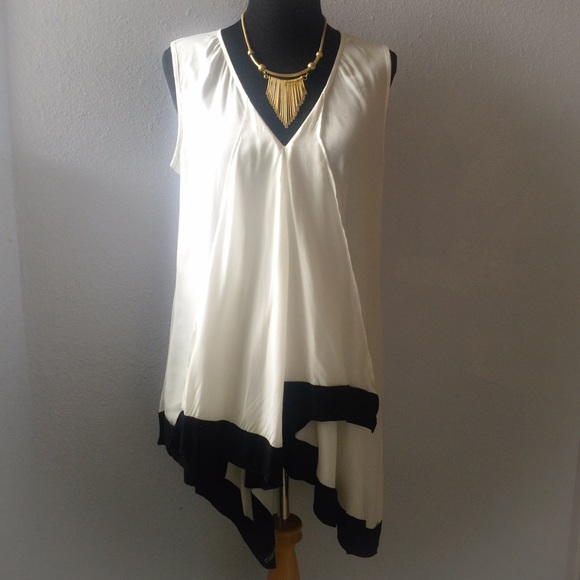 Cream top with black swing hemline