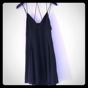 Strappy, low cut black dress