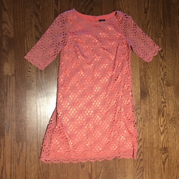Woman's coral colored lace overlay dress