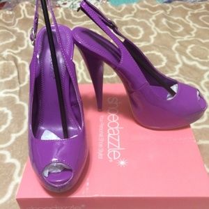 Shoe dazzle purple platform heels  in size 8.5