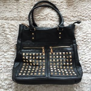 Black purse with gold studs