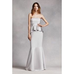 Grey peplum strapless gown.