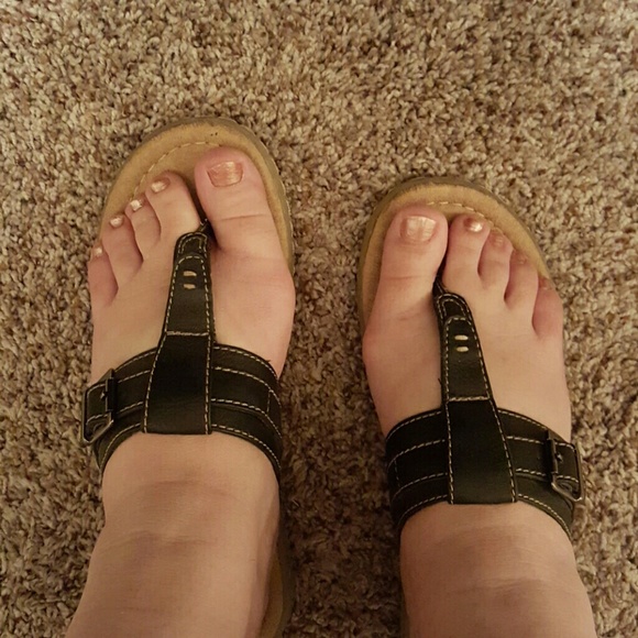 Black leather flip flops