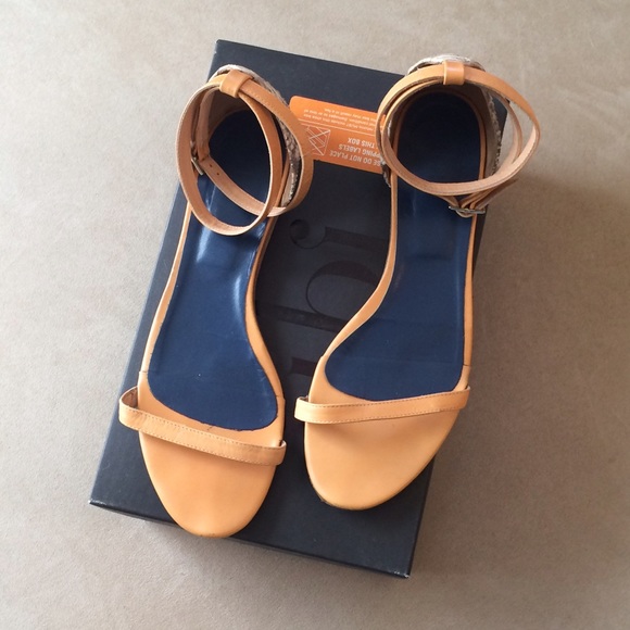 Tibi flat ankle wrap sandals.