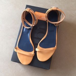 Tibi flat ankle wrap sandals.