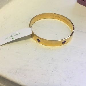 ✨NWT✨ Gold Kate Spade bangle with purple logo