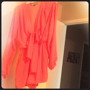 Sexy peach romper. Short. Tie front, open arms