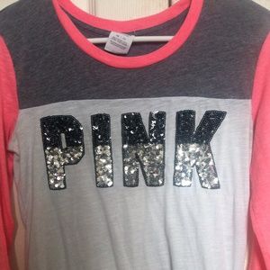Pink quarter sleeve shirt.