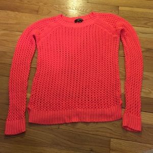 Bright orange sweater