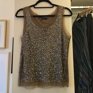 Sequin top with illusion neckline.