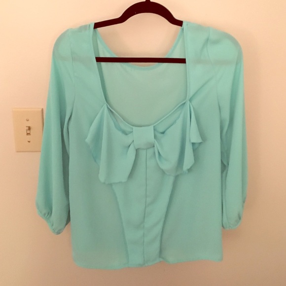 Blue top, bow in back size S.