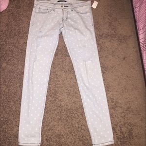 Light wash polka dot distressed skinny jeans