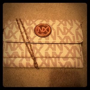 New NX clutch purse on gold colored chain