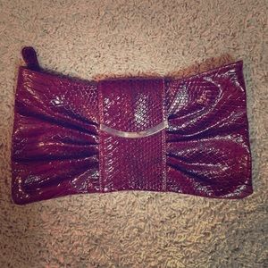 Express deep red snakeskin clutch