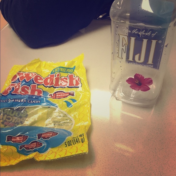 An empty bag of Swedish fish and Fiji water bottle - Picture 1 of 1