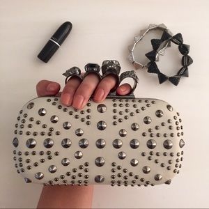 White clutch with studs and skulls