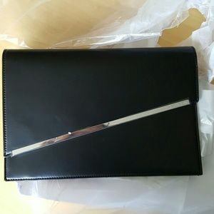 Authentic new adorable BCBG"Kensington' clutch.