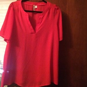 Francesca's red blouse