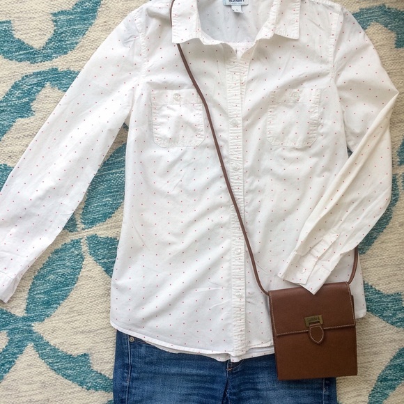 White and pink polka dot button down blouse.