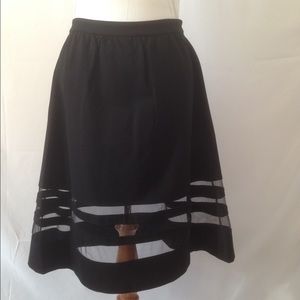 Black knit skirt with unique mesh stripes.