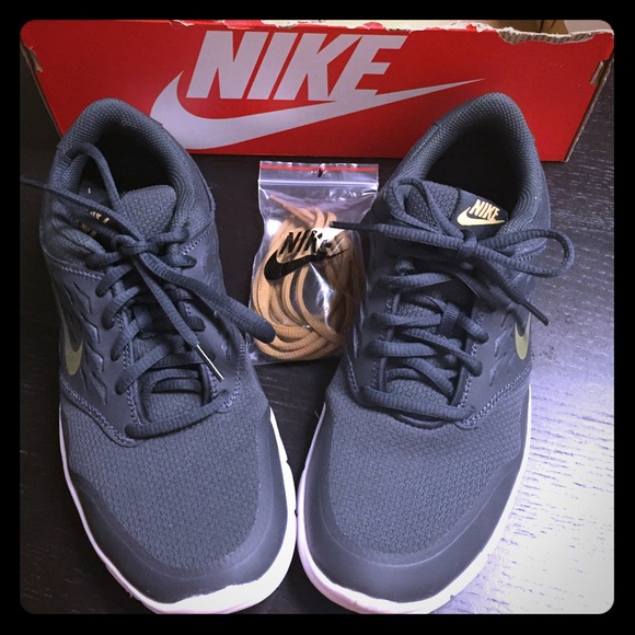 Nike sneakers in Gray and gold. Worn once.