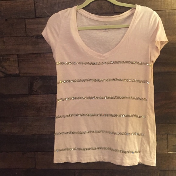 Light pink shirt with sequins lines.
