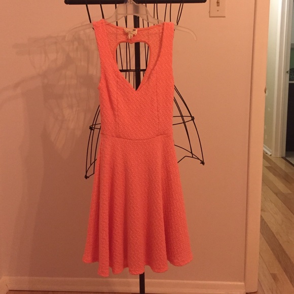 Worn once bright pink dress with heart shaped back