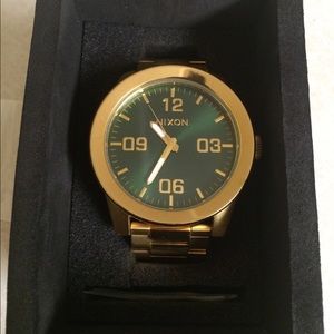 Nixon Corporal SS gold watch with green face