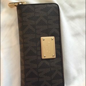 Brown monogram Michael Kors full zip wallet