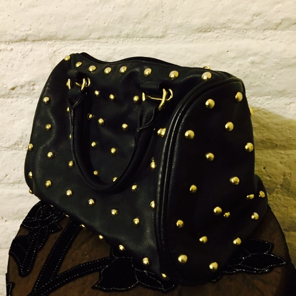Gold studded and leather bag