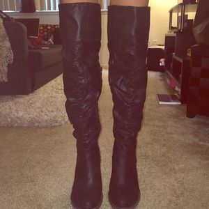 Over the knee black boots