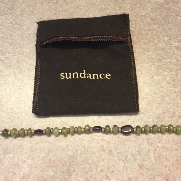 Sundance green stone with 3 garnet stones