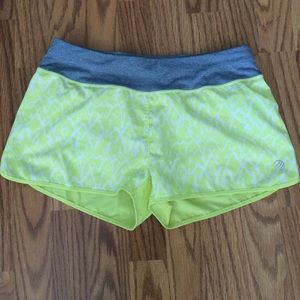 MPG yellow running shorts