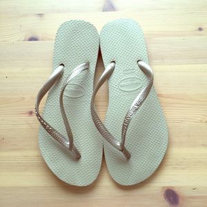 Havaianas gold flip-flops.