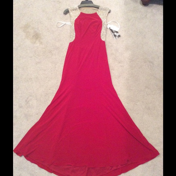 Red gown with silver beaded sheath back and sides.