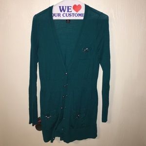 teal sweater with buttons on front