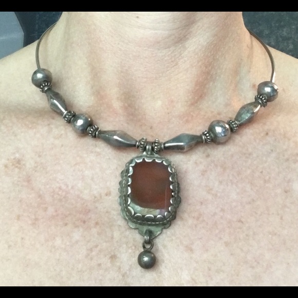 19 inch silver choker with brown pendant.