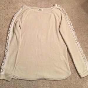 Miracle City cream sweater with lace up the arms